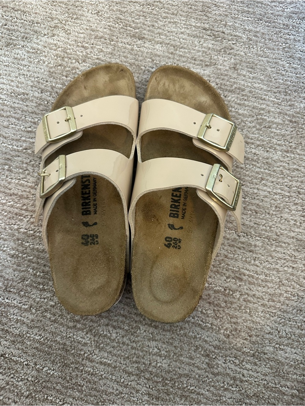 Birkenstock Arizona Patent Two-Strap Sandals in Nude/Beige with Gold Buckles
